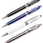A set of four ballpoint pens in black, blue, white, and silver with Harvey Industries printed on each. Each pen features metallic accents and a clip for easy attachment.