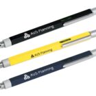 Three ballpoint pens with inscriptions AUS Planning on each, in black, yellow, and dark blue. Each pen features a silver clip and tip, with a stylus end, and includes a level tool on the barrel.