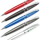 A set of five ballpoint pens in different colors: red, black, blue, silver, and white. Each pen has a clip and the text MMcatering printed on the body.