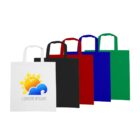A row of five tote bags in different colors: white, black, red, blue, and green. The white bag in the front features a colorful logo of a sun and cloud with the text Lorem Ipsum.