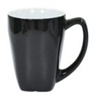 A black ceramic mug with a glossy finish and a white interior is shown against a white background. The mug has a slightly tapered design and a single handle.