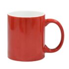 A plain red ceramic mug with a glossy finish, featuring a C-shaped handle, is shown against a white background. The inside of the mug is white.