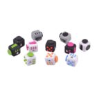 A collection of multicolored fidget cubes arranged in a semicircle on a white background. Each cube features various switches, buttons, and dials for tactile interaction.