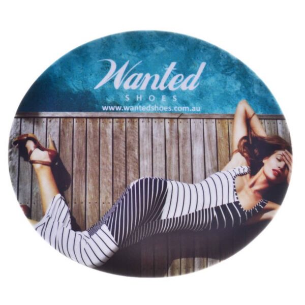 Woman in striped dress lying on wooden bench; Wanted Shoes text above.