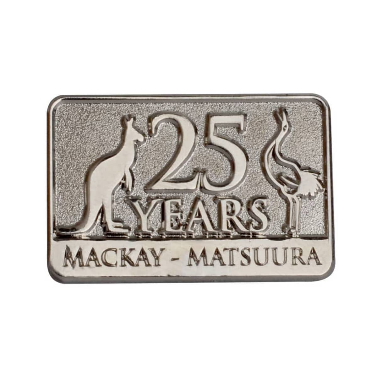 Silver rectangular pin featuring a kangaroo and an emu flanking the text 25 YEARS. Below, it reads MACKAY - MATSUURA.