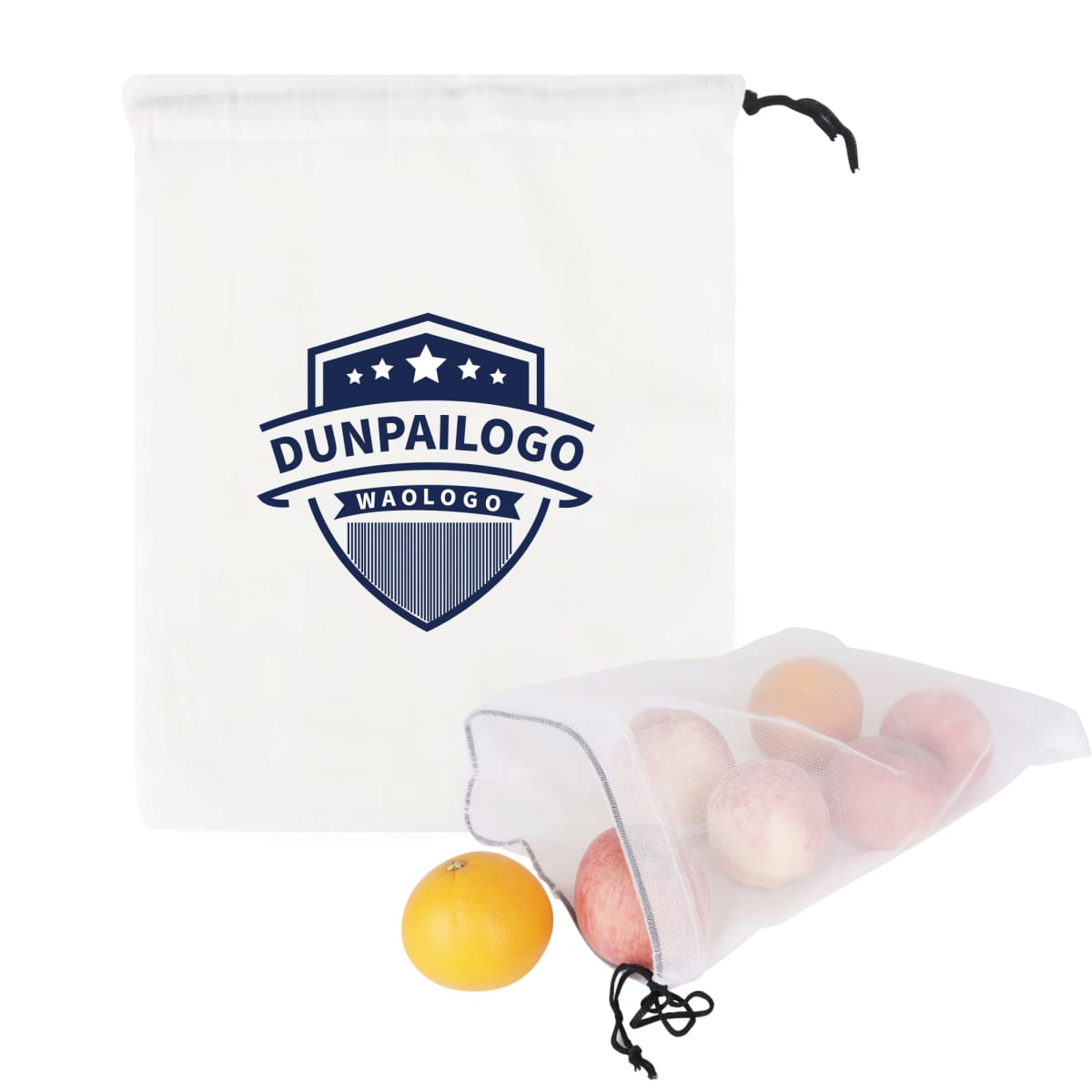 Two white drawstring bags, one standing and one lying down. The standing bag has a blue shield emblem with the words DUNPAILOGO WAOLOGO. The lying bag contains apples and an orange.