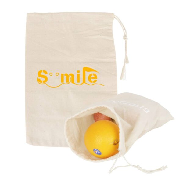 Two beige cloth bags with drawstrings. The upright bag has a yellow Smile logo. The other bag lies open, revealing an orange and an apple inside.