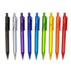 Eight translucent, multicolored retractable pens are lined up vertically against a white background. The colors are black, clear, dark blue, light blue, green, yellow, orange, and red.