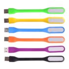 Six colorful LED USB lights arranged vertically. From top to bottom, the colors are green, yellow, blue, orange, purple, and black. Each has a flexible neck and an elongated light area.