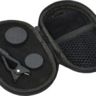 A small black zippered case with a mesh pocket containing a set of circular black lens caps and a clip, likely for a smartphone camera lens. The interior features a molded foam lining for protection.
