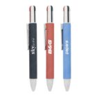 Three retractable pens in black, red, and blue with different brand logos on the barrels.