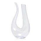 A clear, elegantly curved glass vase with two asymmetrical spouts, forming a graceful teardrop shape. The vase has a modern, artistic design, capturing light and reflections on its smooth surface.