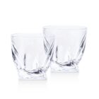 Two clear, elegantly designed whiskey glasses with a twisted, modern shape standing side by side on a plain white background.