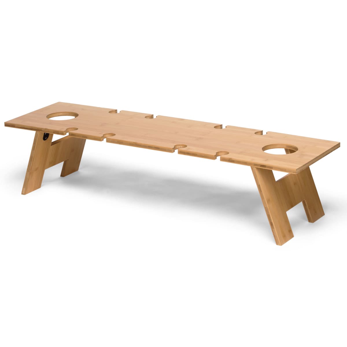 A wooden bench with two wide, angled legs supporting a flat seat featuring multiple circular cutouts. The minimalist design accents its natural wood grain texture and smooth finish.