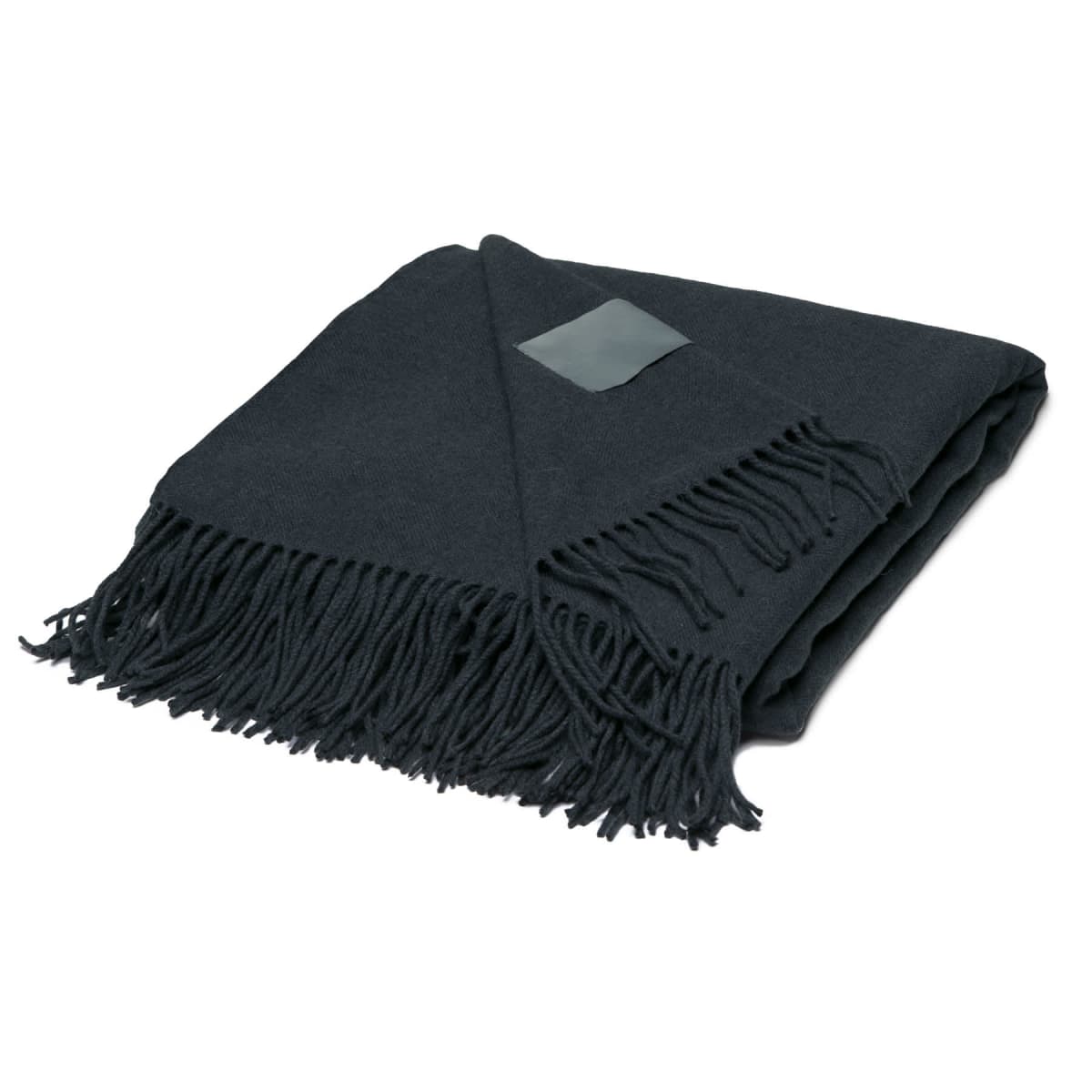 A folded dark green wool blanket with fringed edges on one side. A small rectangular tag is visible on the blanket.