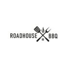 Logo for Roadhouse BBQ featuring a crossed spatula and fork with fire elements above a small house graphic. The text Roadhouse BBQ is displayed between the utensils.