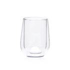 A clear, empty glass cup with a double-walled design is shown against a white background.