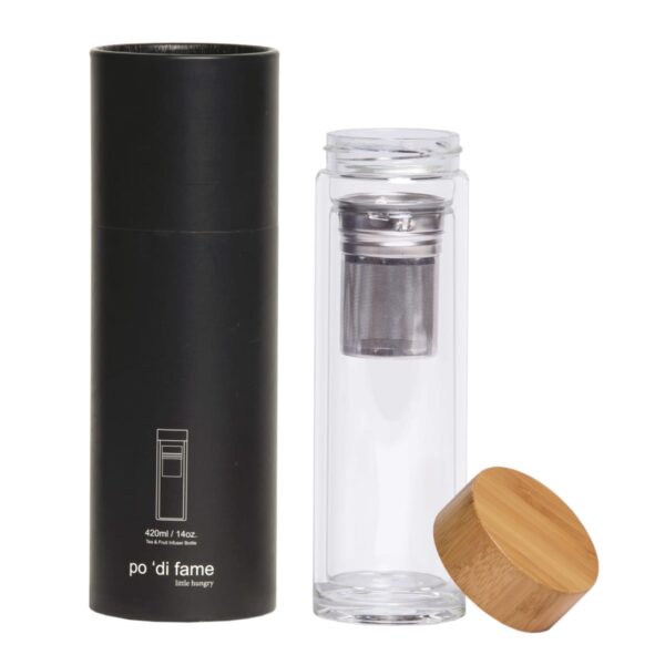 A transparent glass tea infuser with a stainless steel filter and a bamboo lid stands next to a black cylindrical box. The box displays the brand name po di fame and the text 420ml / 14oz.