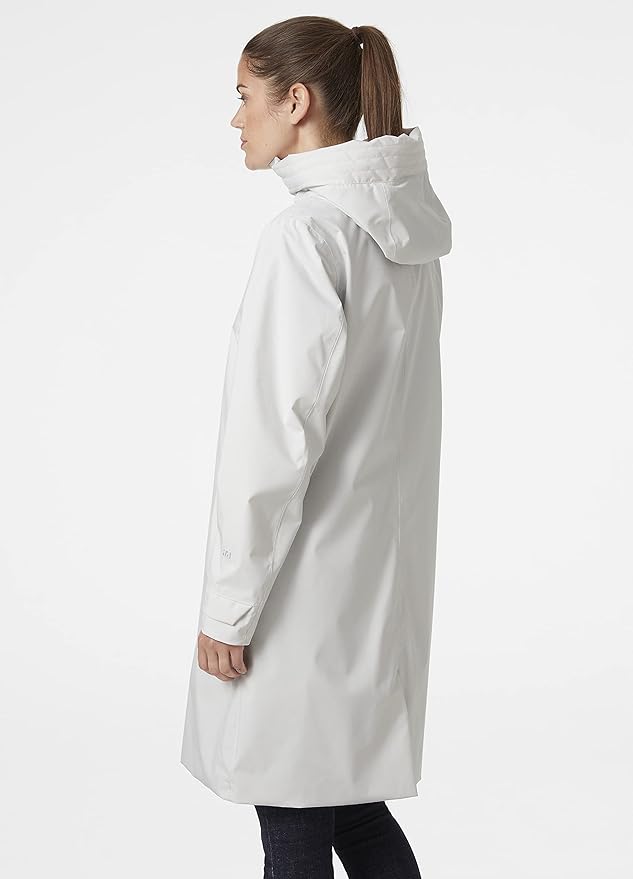 woman wearing a white poncho with her hair tied