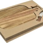 A wooden cheese board set in its packaging includes an acacia wood board shaped like a bottle and a cheese knife with a matching wooden handle, both nestled in brown cardboard.