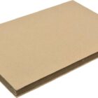 A stack of brown cardboard sheets is neatly piled on a white background. The edges are aligned, showing a uniform thickness. The surface appears smooth and unmarked, suitable for crafting or packaging purposes.