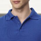 Man wearing a blue collared polo shirt, shown from chest to just below the nose.