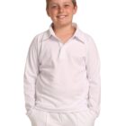 A smiling boy stands with his hands in his pants pockets, wearing a white long-sleeved collared shirt and white pants.