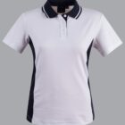 White and black polo shirt with short sleeves on a grey background.