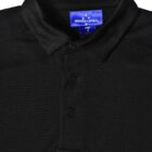 Black collared polo shirt with three buttons and a tag reading Winning Spirit.