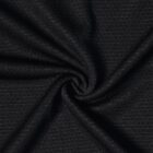 Close-up of textured black fabric with a spiral fold pattern.