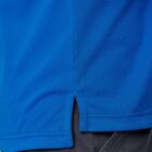 Close-up of a blue shirt hem with a side slit, worn over dark pants.
