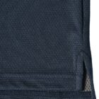 Close-up of a dark blue textured fabric with a small slit at the bottom edge.