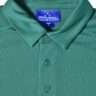 Green collared shirt with buttons and blue label.