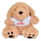 A fluffy beige stuffed animal dog with floppy ears and black nose, wearing a white shirt displaying the red logo and text Condor. The dogs paws are visible, with black pads contrasted against the light fur.