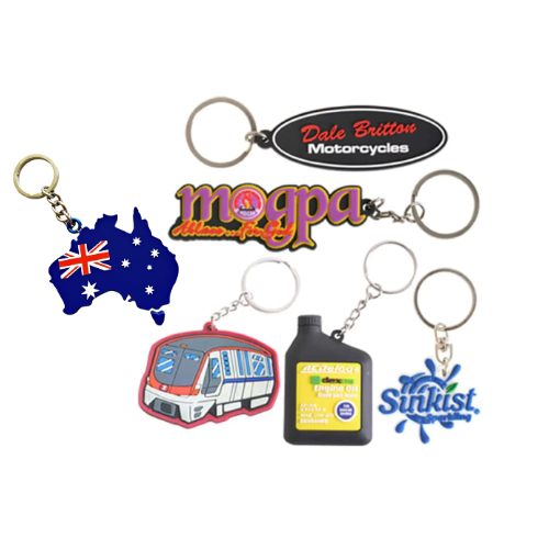 The Kinsley Custom Shape PVC Keyrings offer a vibrant collection of six designs: Australia map, Dale Britton Motorcycles, morga text, train, Aircleaner Ferrous Oil bottle, and Sunkist splash. These colorful keyrings are artfully displayed on a white background.