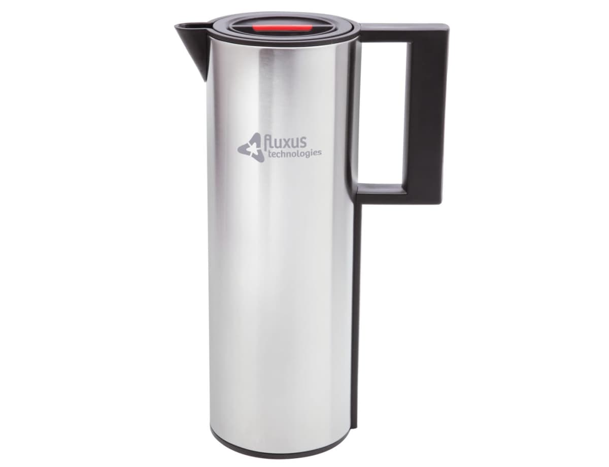 A sleek, silver stainless steel thermos with a black handle and lid, featuring a red button on top. The logo Fluxus technologies is printed on the side. The design is modern and minimalist.
