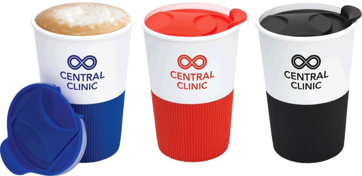 Three Central Clinic branded cups with different color lids and grips: blue, red, and black. The blue lid is detached. The cups feature a logo with two interlocking circles and text in the center.