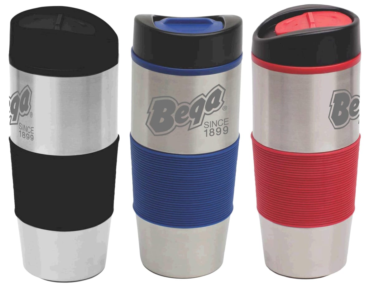 Three stainless steel travel mugs with ribbed grips and flip-top lids. The mugs feature the Bega branding and are colored with black, blue, and red grips respectively. Each mug has the text Since 1899 under the logo.
