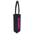 A tall, black fabric tote bag designed to hold a single bottle. It has a long handle and features the word COSMOPOLITAN printed vertically in bright pink letters on the side.