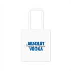 A white tote bag with the blue text ABSOLUT Country of Sweden VODKA printed on the front. The bag has long white handles.