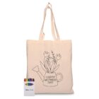 A beige tote bag with an outline of a watering can holding flowers and the text HAPPY MOTHERS DAY. Next to it is a pack of colorful crayons.