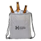 A gray drawstring bag with the text Victoria Harbour Melbourne printed on it, filled with ice and three beer bottles. The bag has a front pocket and black drawstrings.