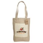 Beige canvas tote bag with long handles and a front pocket. The pocket displays a logo reading Fireside Coffee Co. Est. 1988 with a steaming coffee cup icon. A brown tag is attached to one handle.