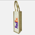 A rectangular jute tote bag with two handles, featuring the FedEx logo in blue and orange on a white panel.