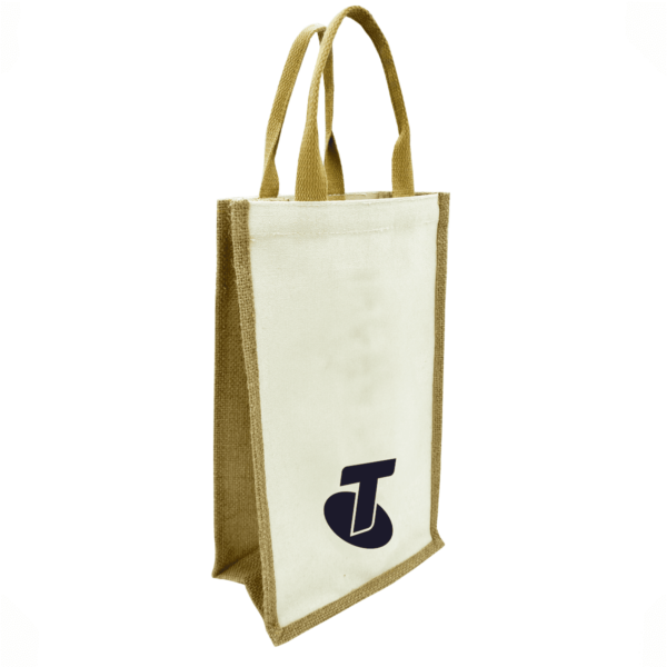 A beige and brown tote bag with handles, featuring a bold, dark logo on the lower front. The bag appears to be made of fabric with textured edges, standing upright against a white background.