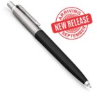 A sleek black and silver pen with a clickable top is displayed. There is a red circular stamp graphic nearby that reads New Release Arriving September.