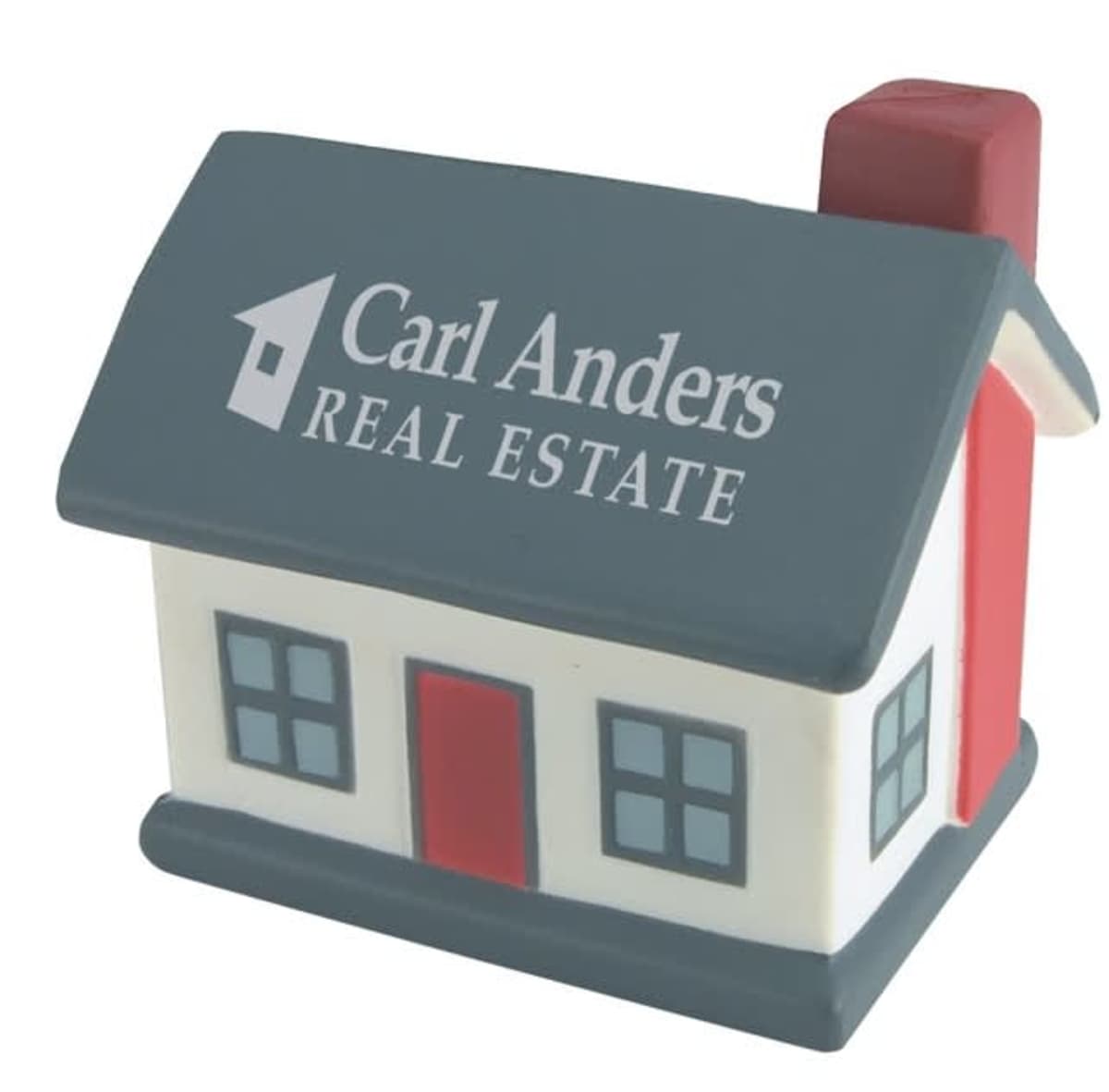 A small, house-shaped stress ball featuring the text Carl Anders Real Estate on the roof. The house has a gray roof, red door, and red chimney.
