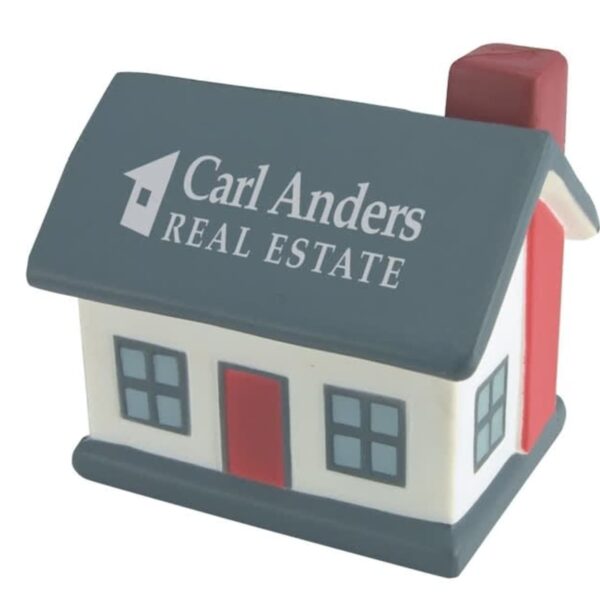 A stress ball shaped like a small house with a gray roof, red door, and red chimney. The text Carl Anders Real Estate is printed on the roof.