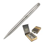A sleek silver pen with a textured finish and a clip is displayed alongside its packaging. The box is black and gold, featuring the brand name. It includes a refill and a separate compartment inside.