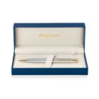 A silver and gold ballpoint pen displayed in a blue and cream Waterman Paris gift box. The pen is lying on a soft, cushioned insert, highlighting its elegant design and luxurious finish.